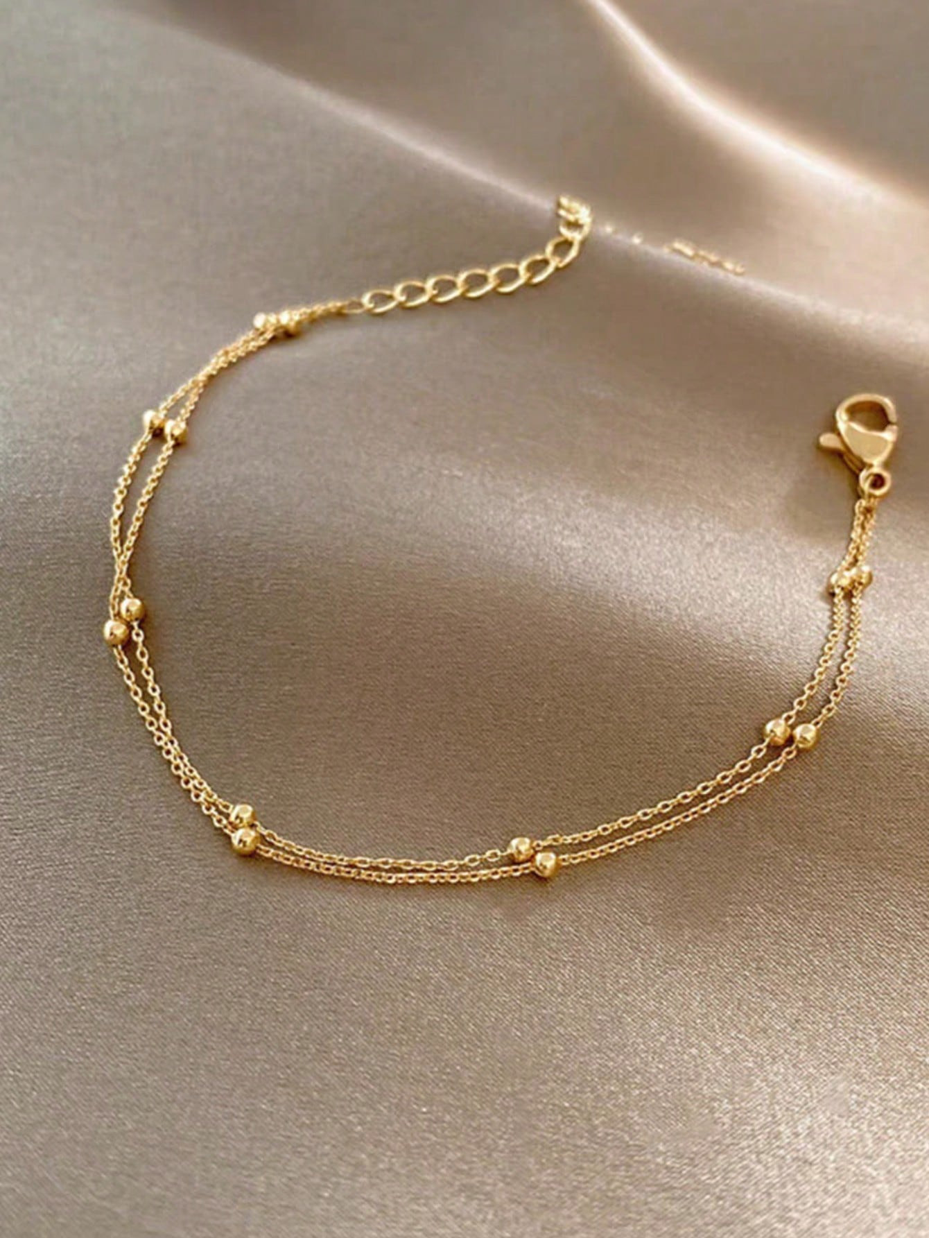 1 pièce Bracelet de cheville à double couche de perles de bonne chance de couleur or pour femmes, à la fois à la mode, luxueux et polyvalent, convient pour être porté sur la plage, la vie quotidienne et d'autres occasions - 31476961